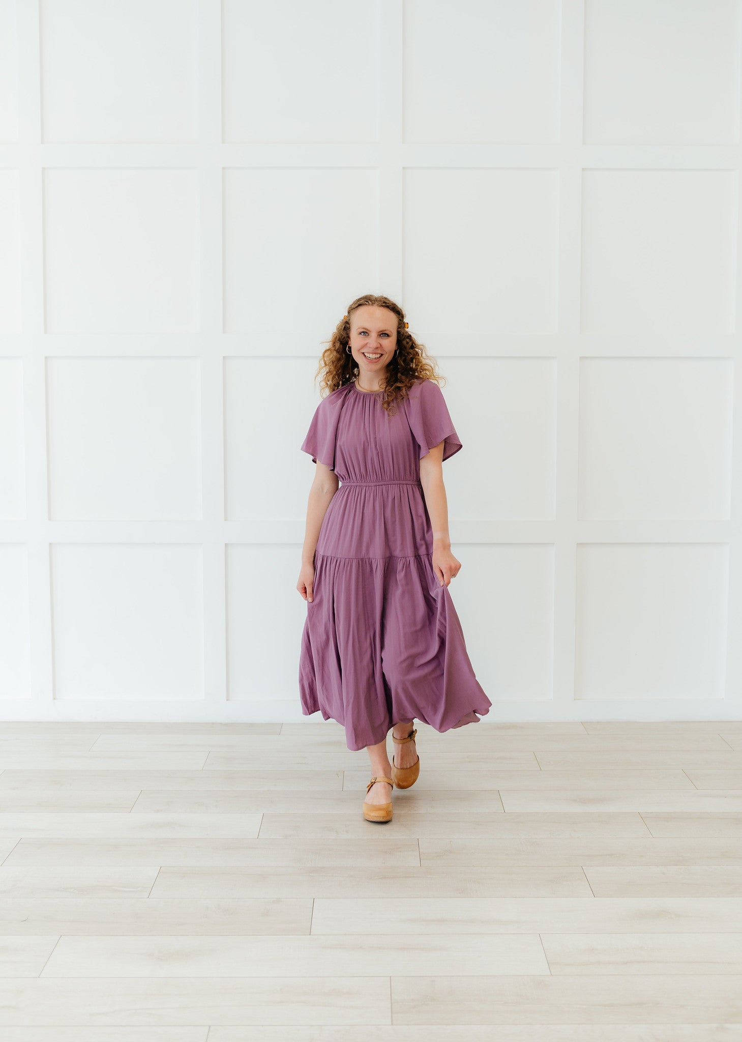 woman wearing a purple dress