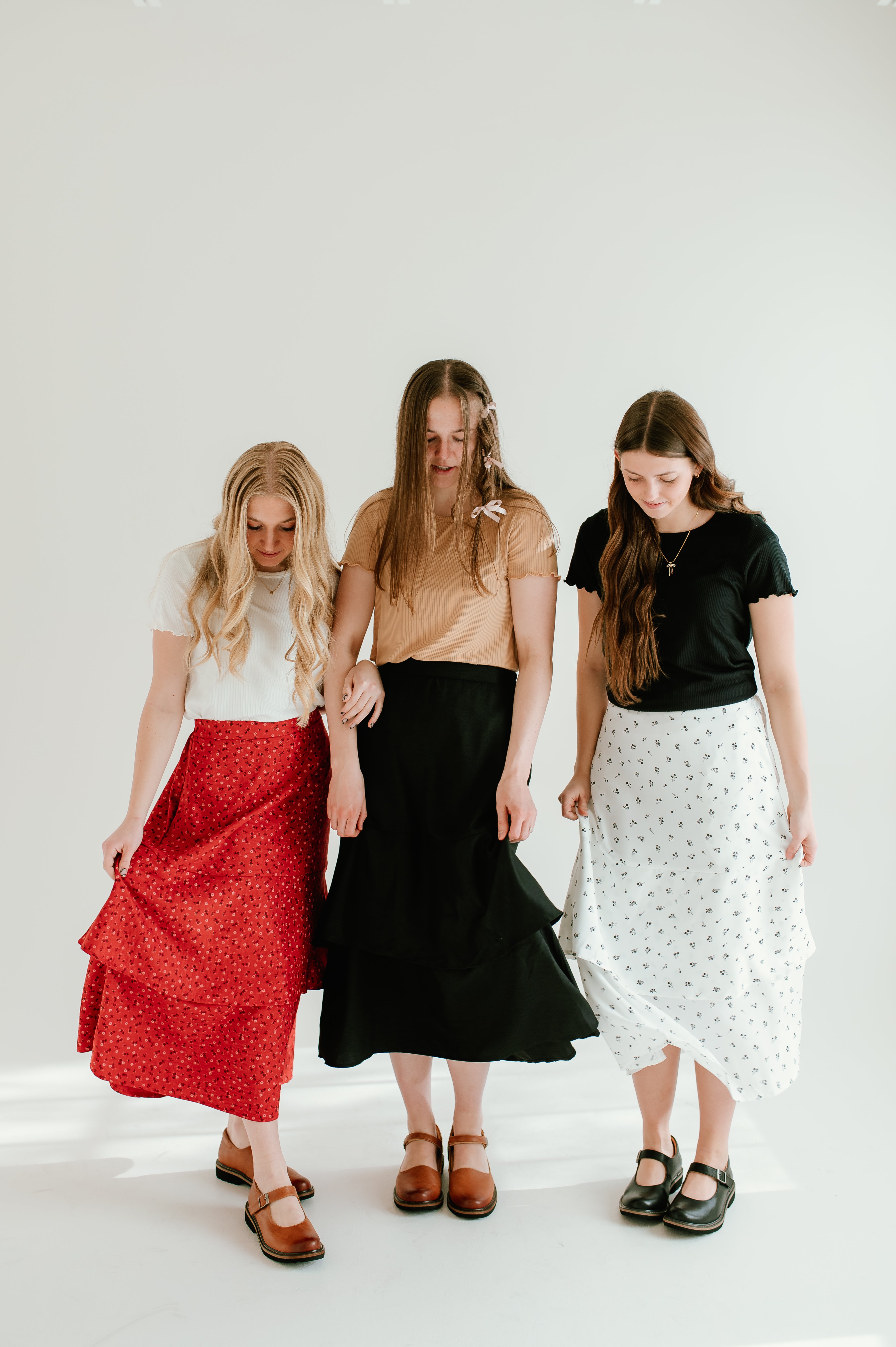 red floral, black, and white floral tiered midi skirts