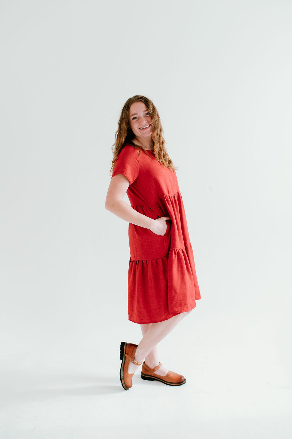 red modest midi (right below the knee) dress with pockets.