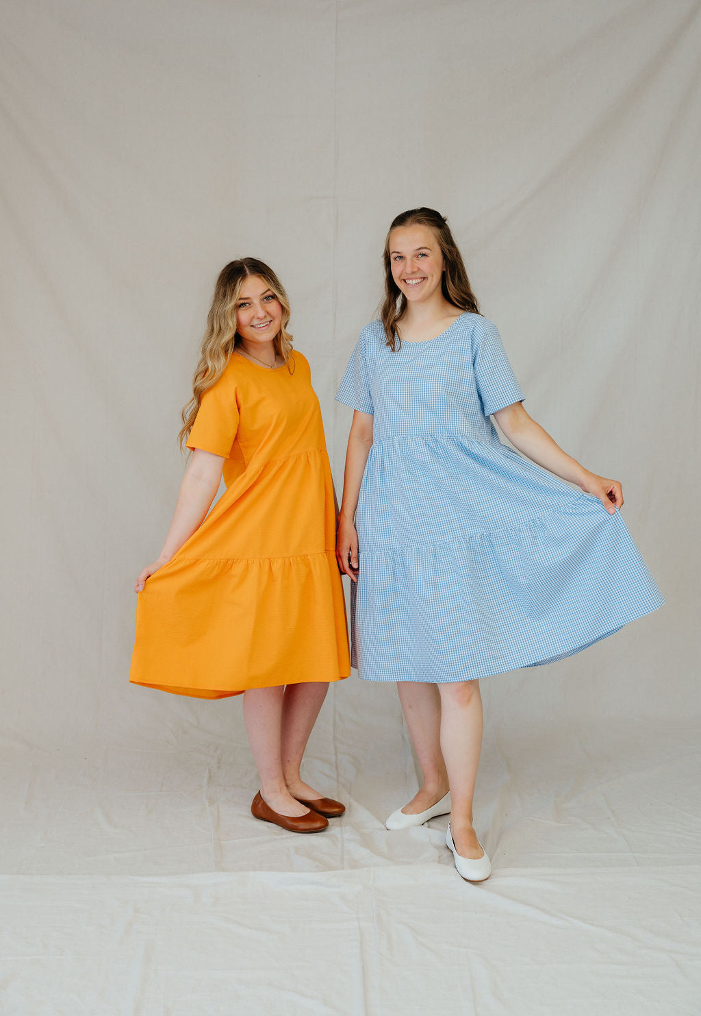 This dress features a tiered skirt, flowy sleeves, and pockets! 