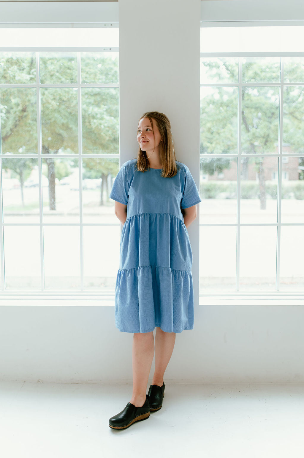 This dress features a tiered skirt, flowy sleeves, and pockets! 