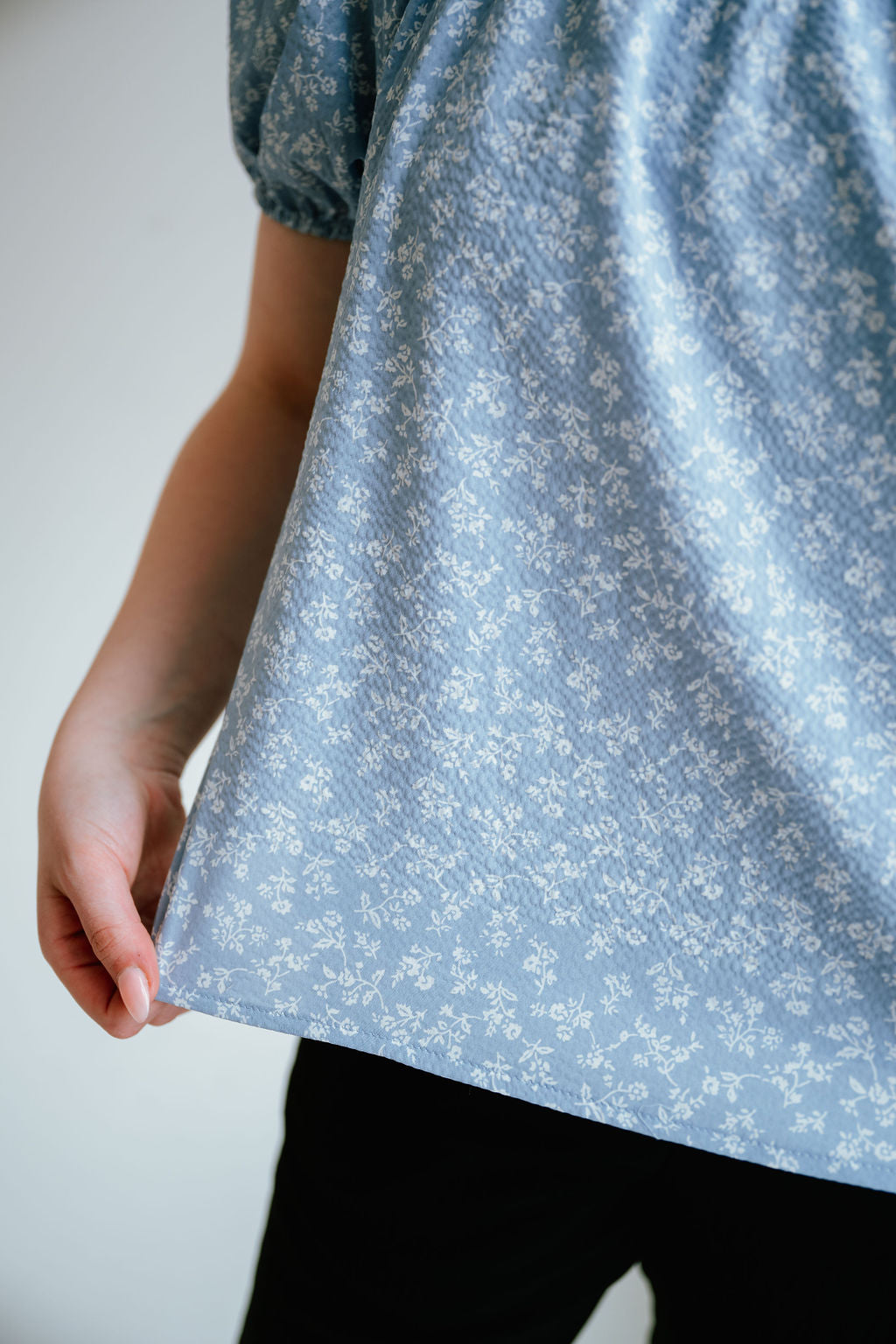 floral top with a soft square neckline, puff sleeves and flowy bodice