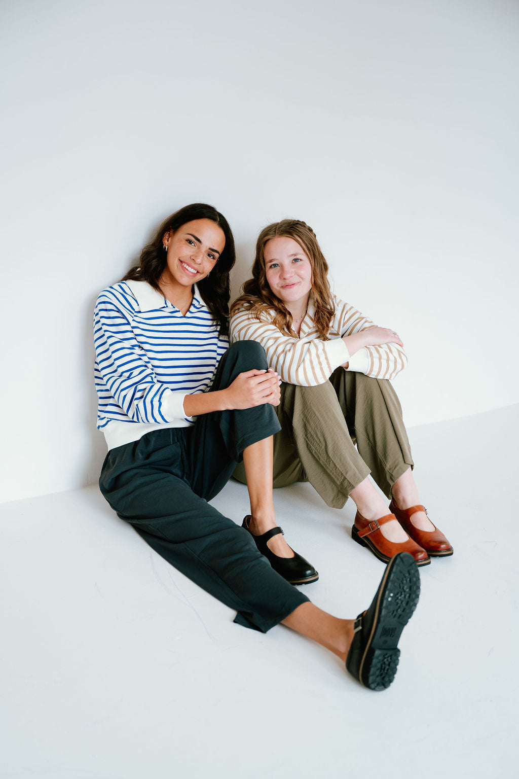 blue and tan striped pattern collared sweatshirts