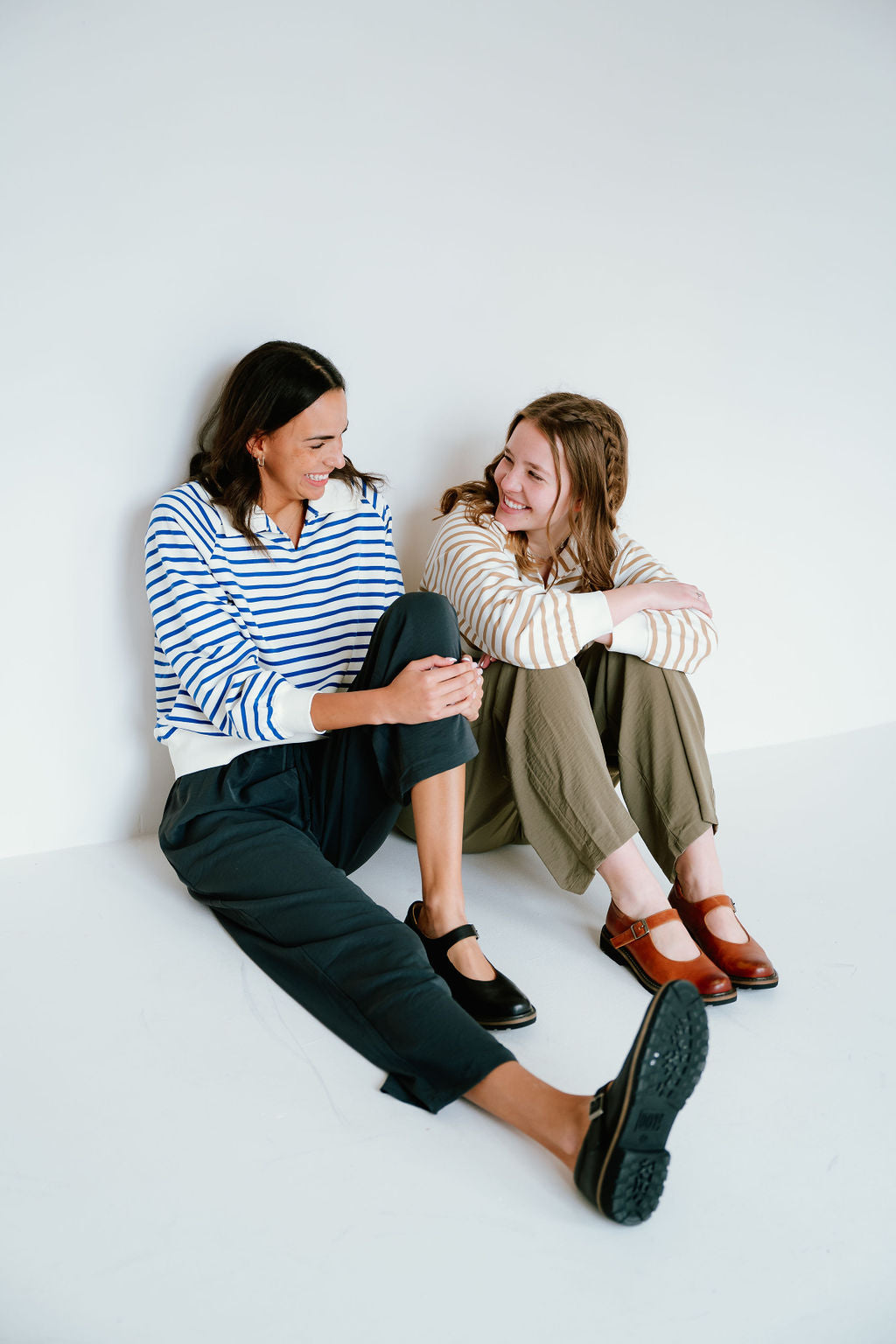 blue and tan striped pattern collared sweatshirts
