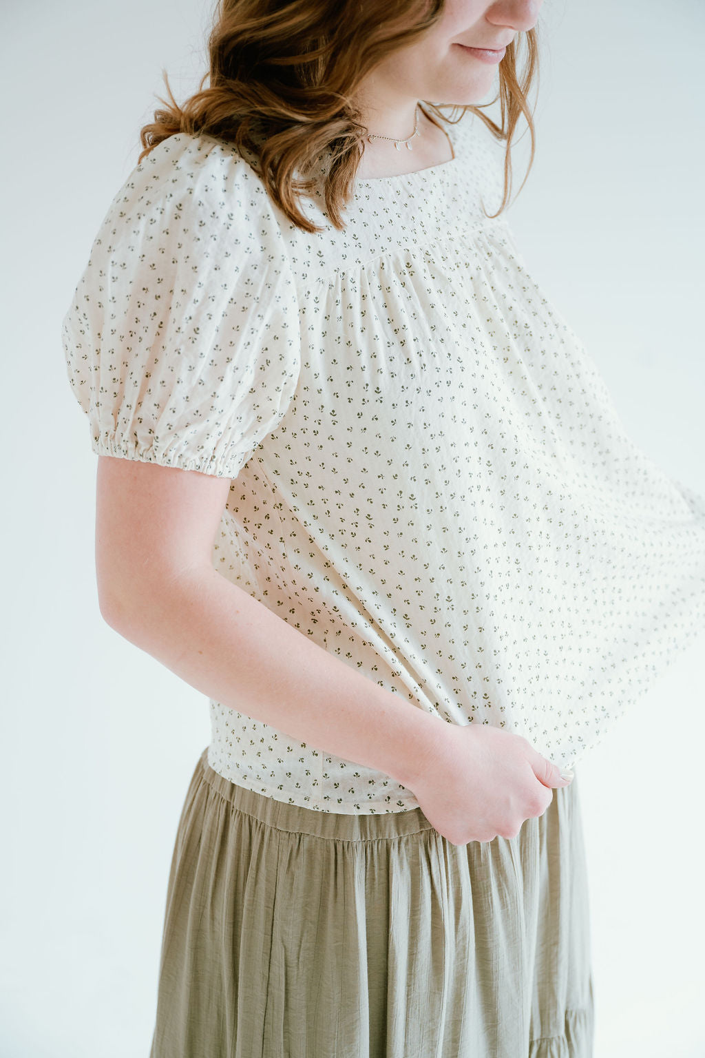 floral top with a soft square neckline, puff sleeves and flowy bodice