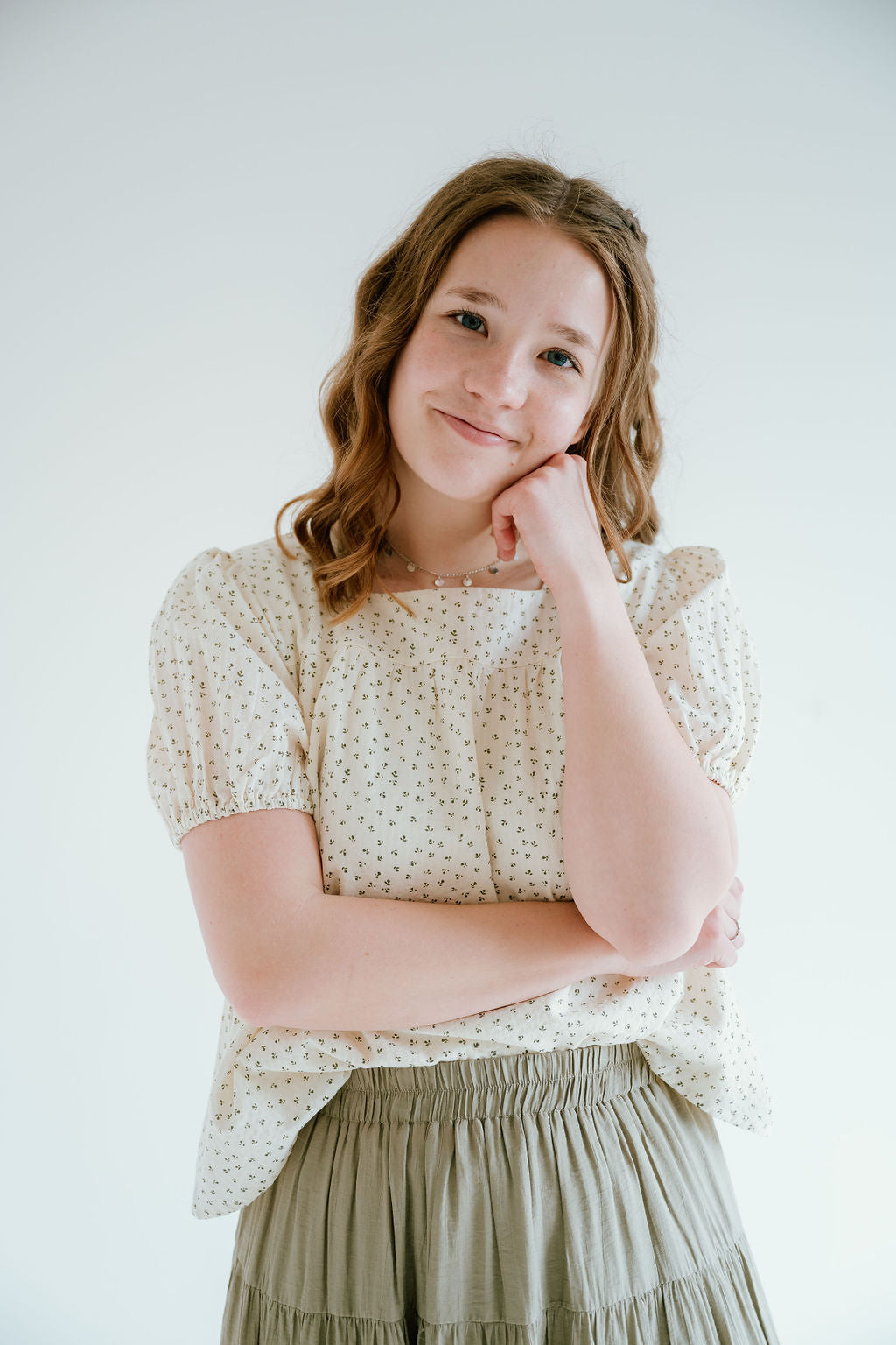 floral top with a soft square neckline, puff sleeves and flowy bodice