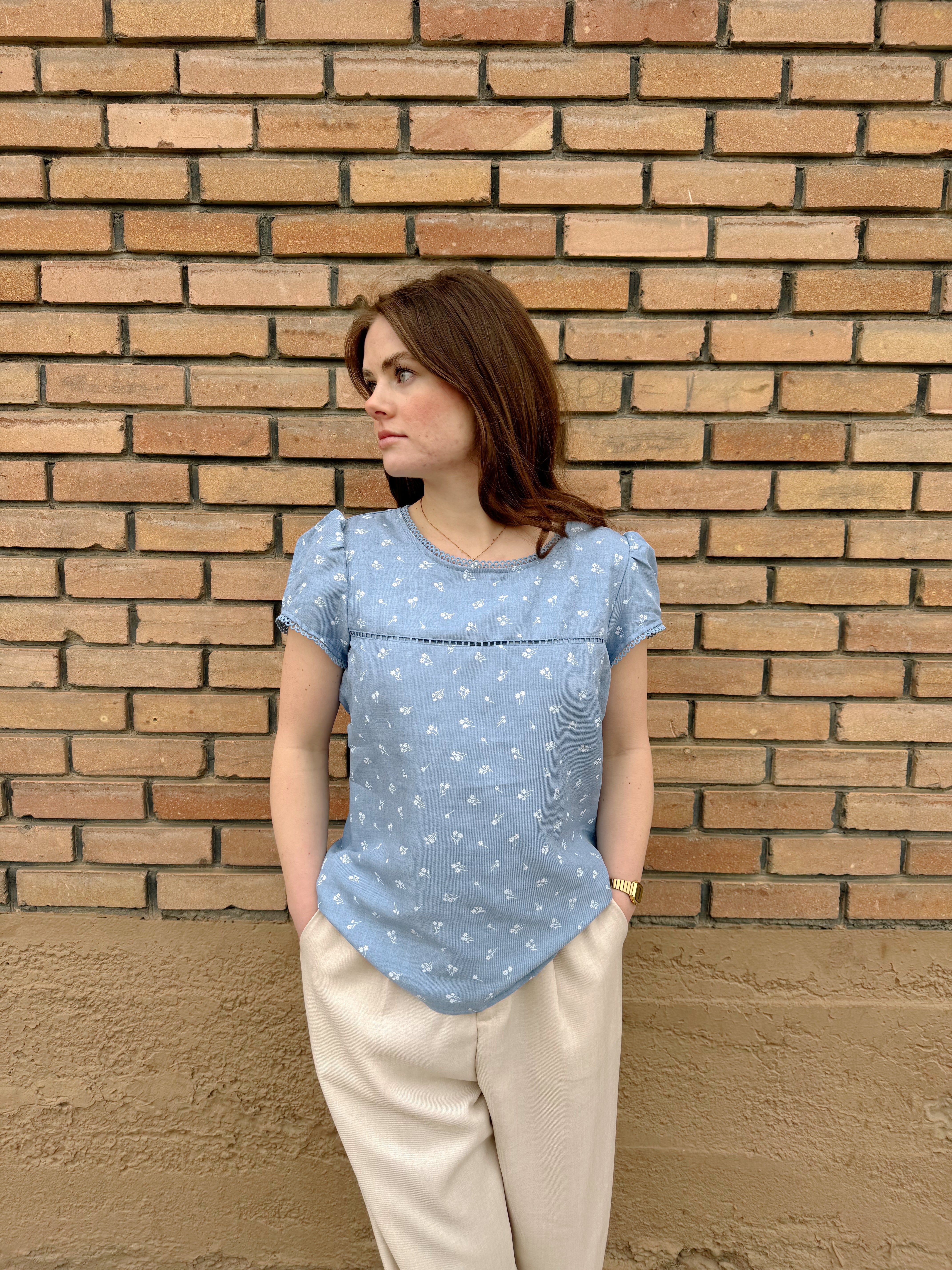Light blue Hampton Top with white floral pattern, relaxed fit, and short sleeves, perfect for casual summer wear.