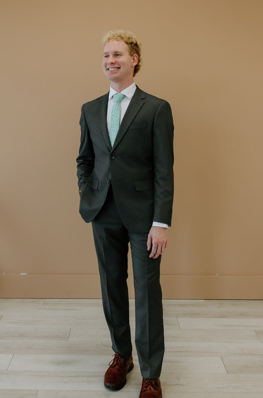 Man wearing charcoal suit